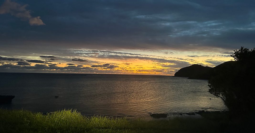 A beautiful image of a sunset over a Lord Howe Island beach