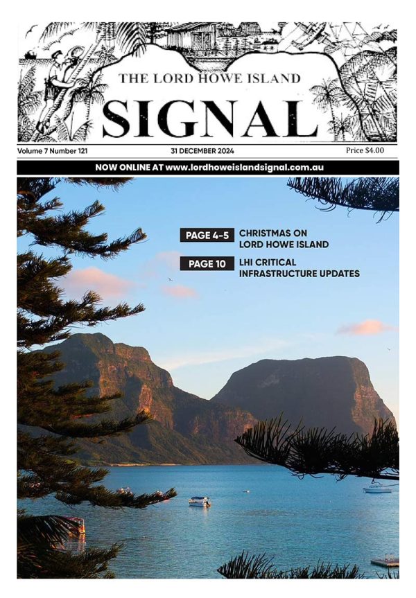 The front page of the Lord Howe Island Signal with an idyllic coastal scene showcasing a broad view of a blue lagoon with coral patches, surrounded by a sandy shore, lush green hills, and two towering, rugged mountain peaks under a clear blue sky.